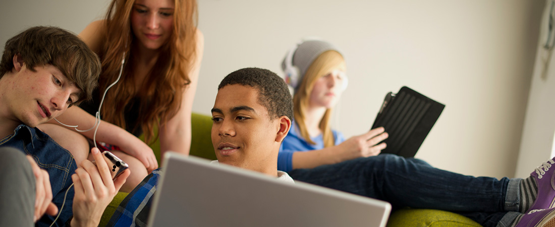 Picture of teenagers using computers.