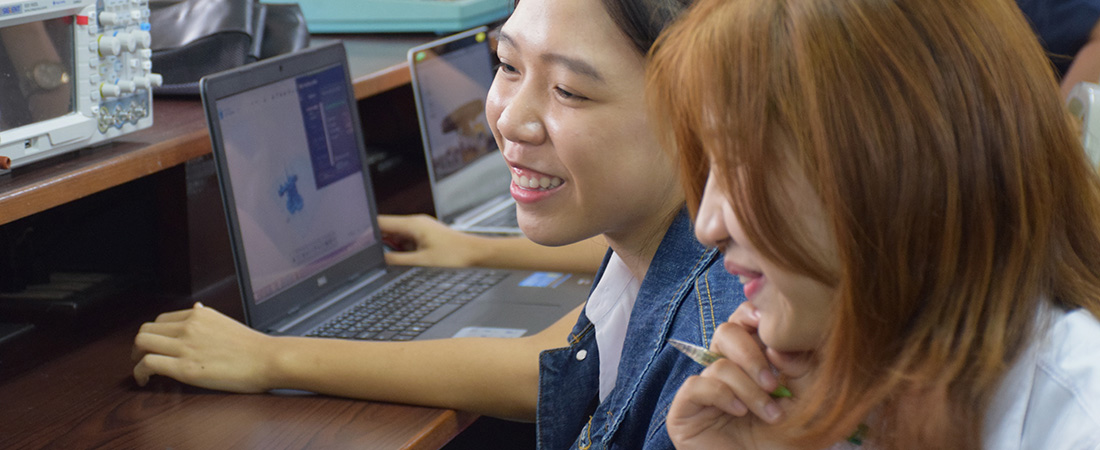 A photo of women using a computer.