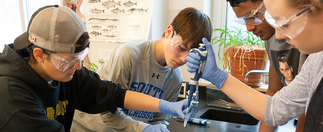 A photo of students taking part in Amgen Biotech Experience