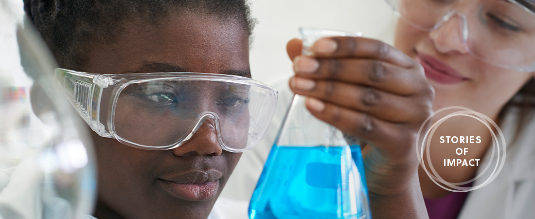 A photo of a student working in a lab representing Bringing Biotech Learning to East Boston High School Students