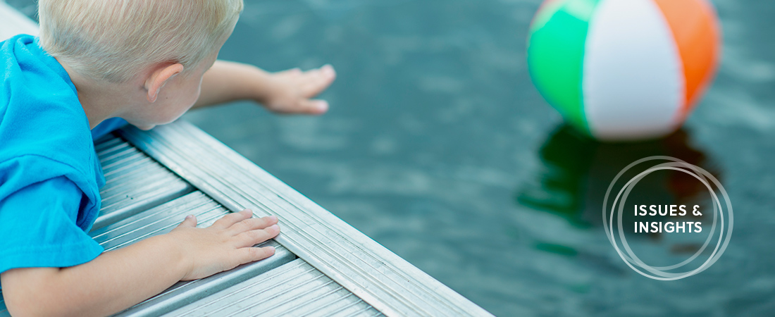 A photo of a child near a pool