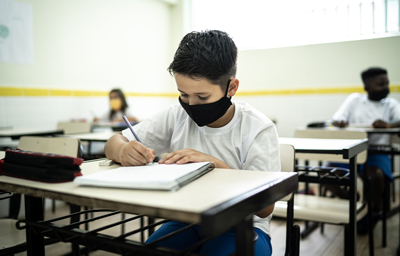 A student in a classroom representing Helping Students Make and Keep Friends in the COVID-19 Era