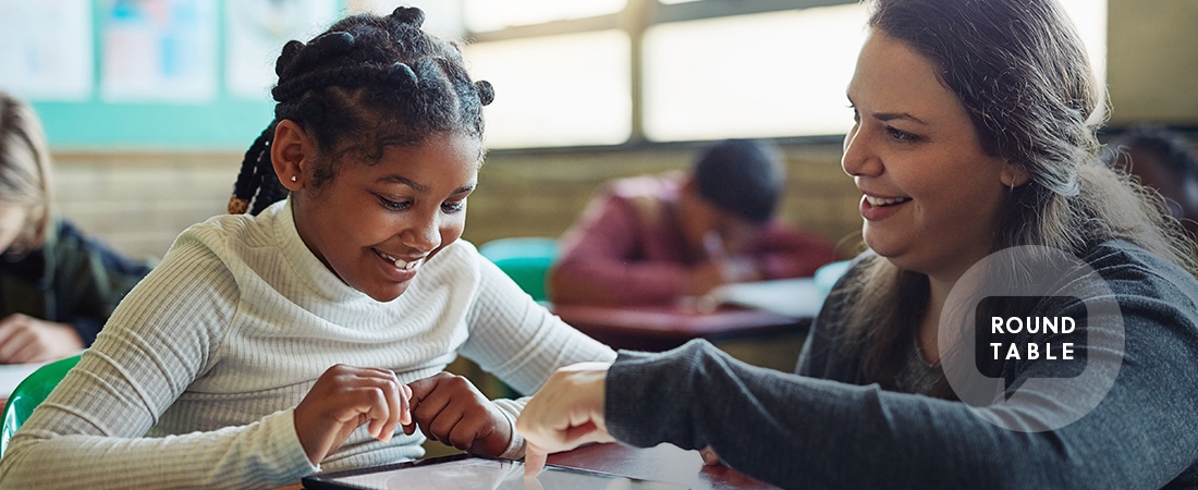 A photo of a teacher and student representing Taking Stock of Learning Loss