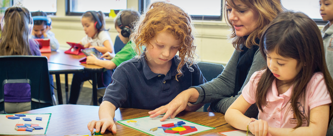 A photo of teacher and students representing EDC Talks: Examining Research Protocols