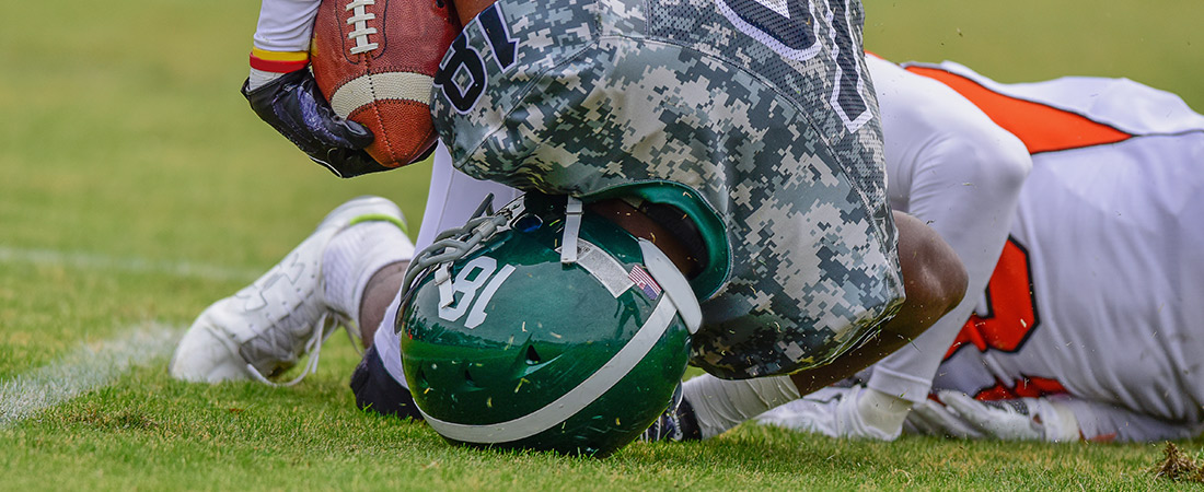 Student athletes playing football