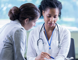 A photo of healthcare worker with patient