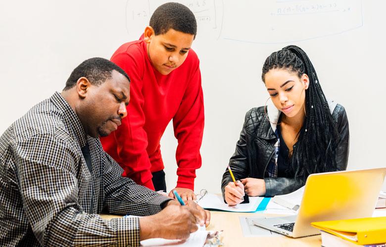 A photo of a mentor and students representing Making Computer Science Mentorship Work