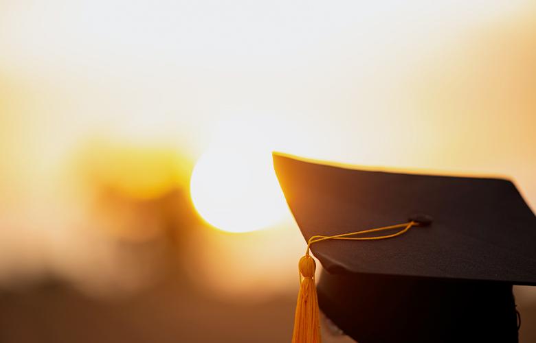 A photo of a graduate representing Championing Higher Education in Prisons