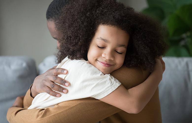 A photo of parent and child representing Tips for Parents: Integrating SEL into Remote Learning