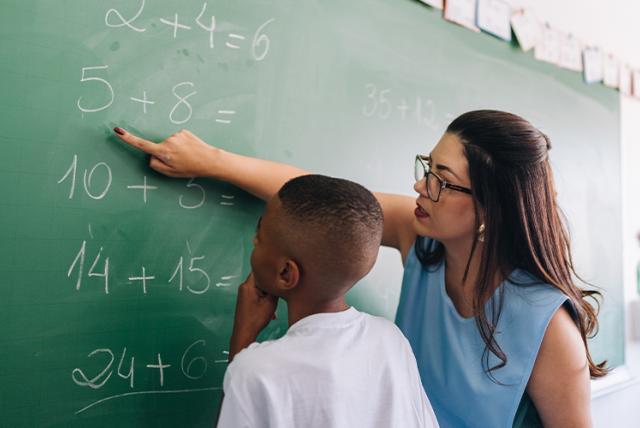 A photo of a student and teacher representing Out of the College Classroom and into the Community: Building Teachers’ Cultural Awareness and Competence 