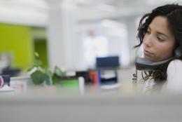 A picture of a reporter on the phone