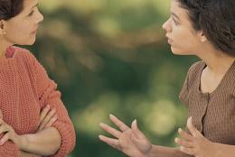 A teenager talking with her mother.