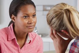 A therapist talking to a patient.