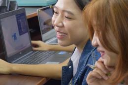 A photo of women using a computer.