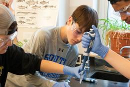 A photo of students taking part in Amgen Biotech Experience