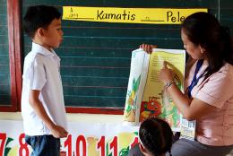 A photo of teacher and student from Basa Pilipinas program