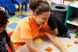 A photo of preschool teachers Harley Cronshaw and students.