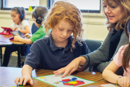 A photo of teacher and students representing EDC Talks: Examining Research Protocols