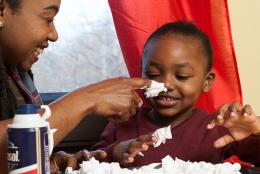 A photo of a child engaged in a science activity