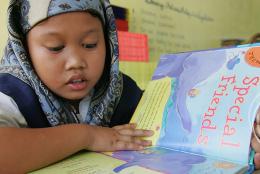 A photo of a student reading in the Philippines