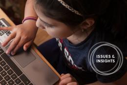 Photo of a child using a computer