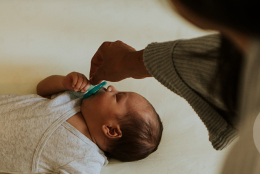 A photo of a parent and child representing Making Sleep Safer for Infants